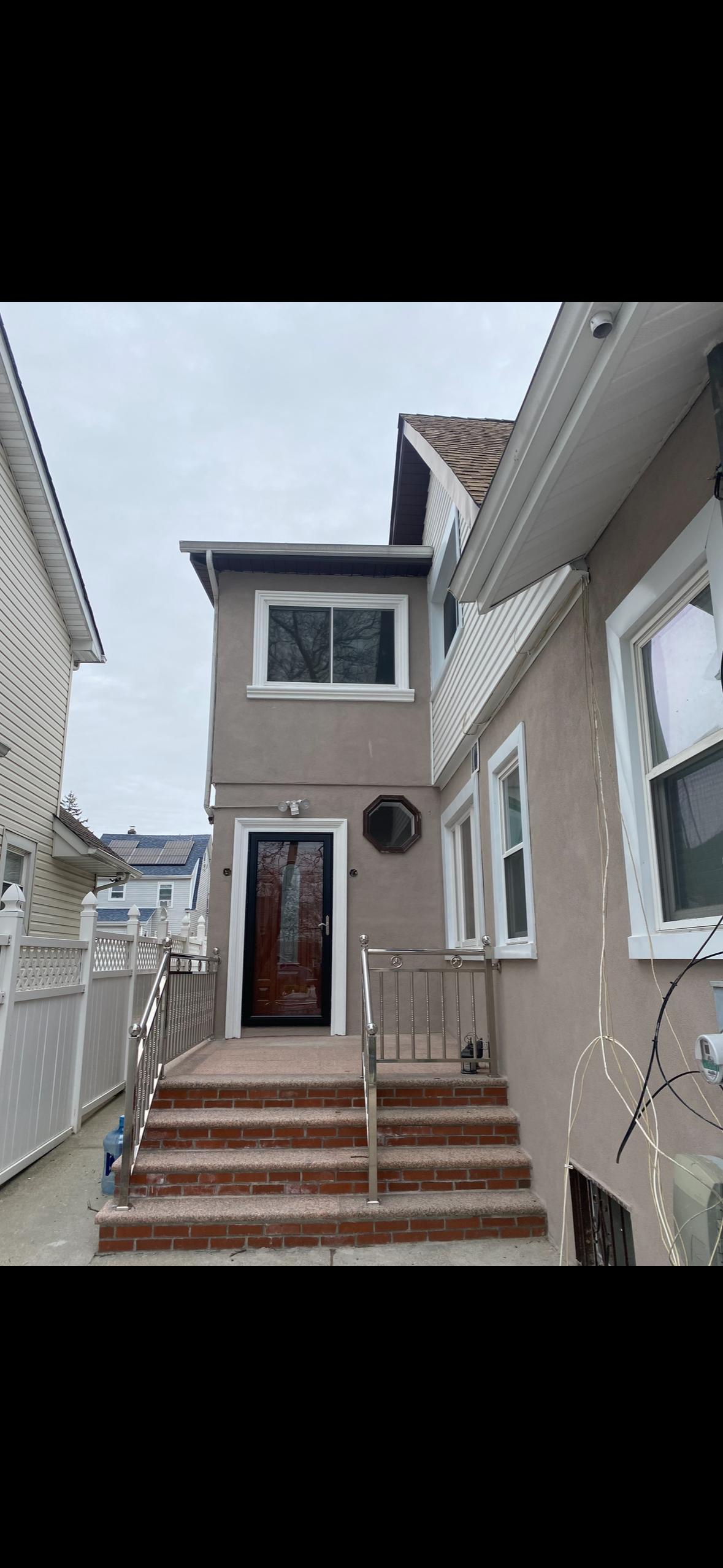 Completed exterior stucco and door installation