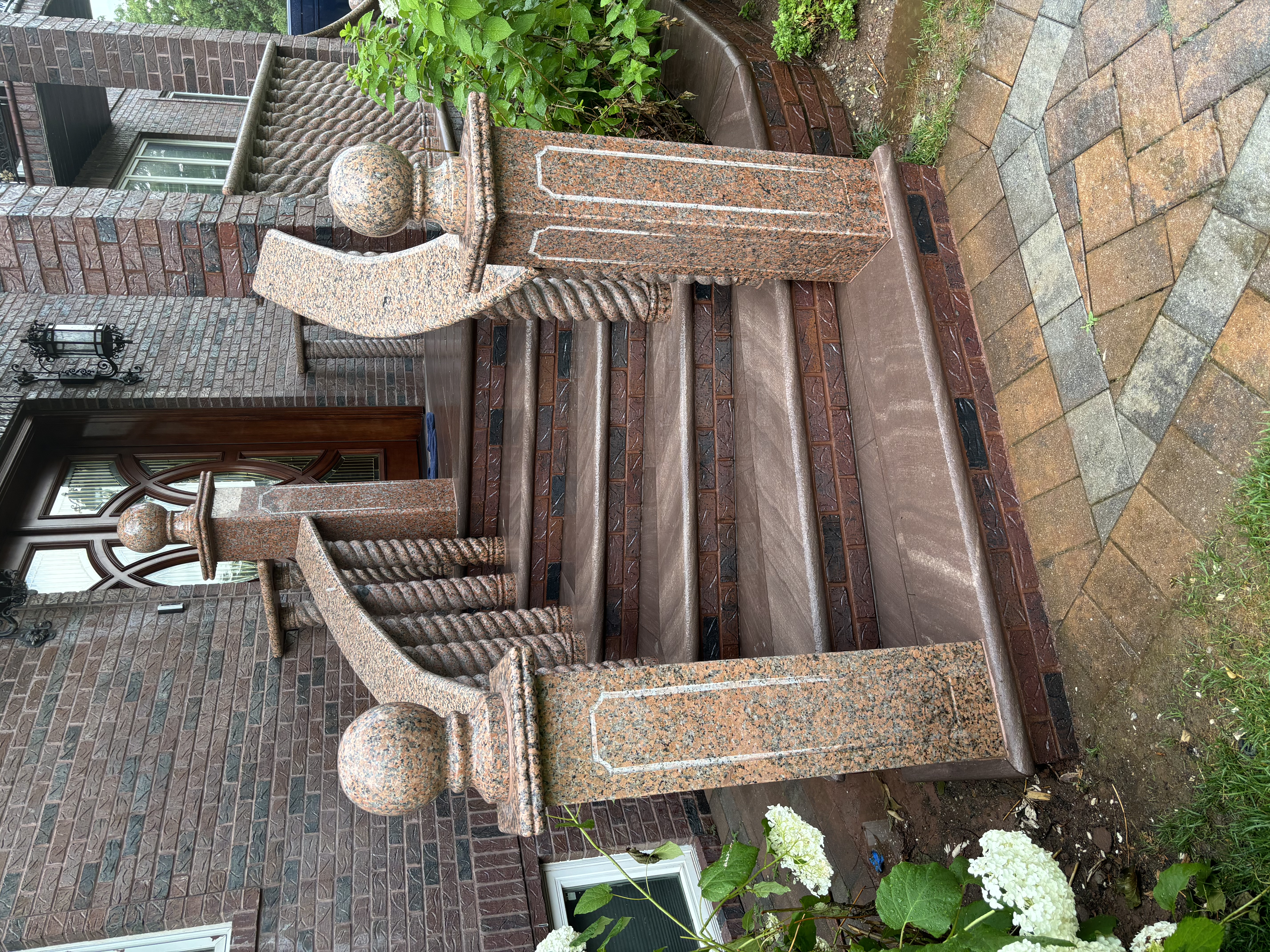 Elegant ornate granite staircase with decorative balusters
