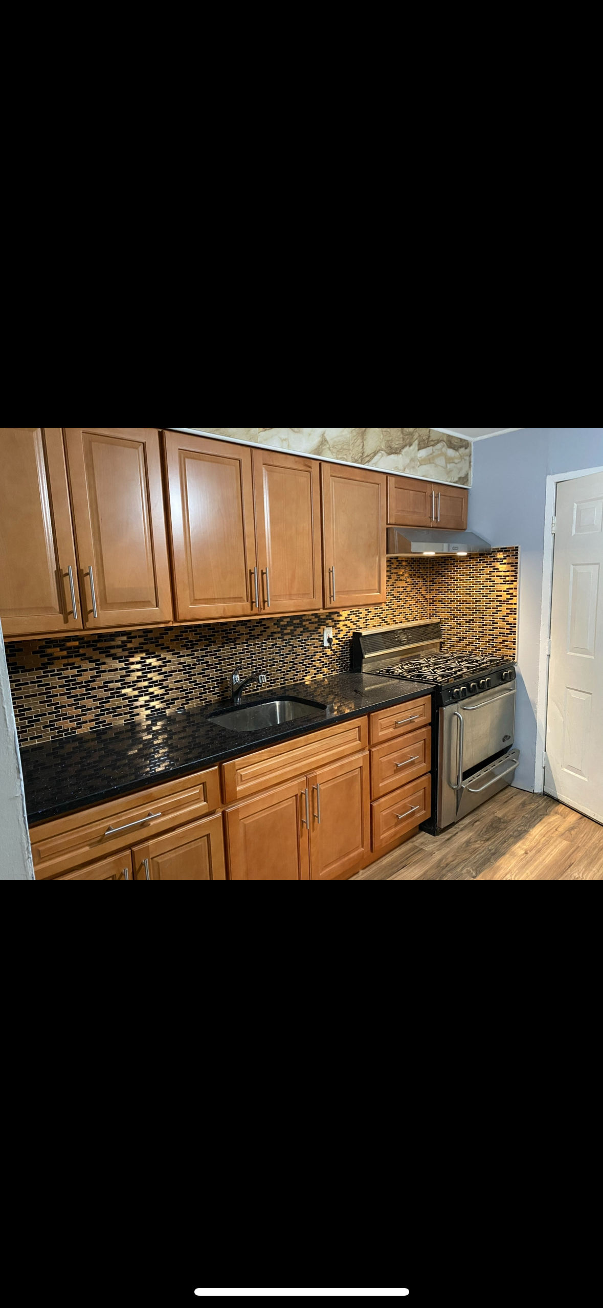 Modern Kitchen Remodel with granite counters and mosaic backsplash