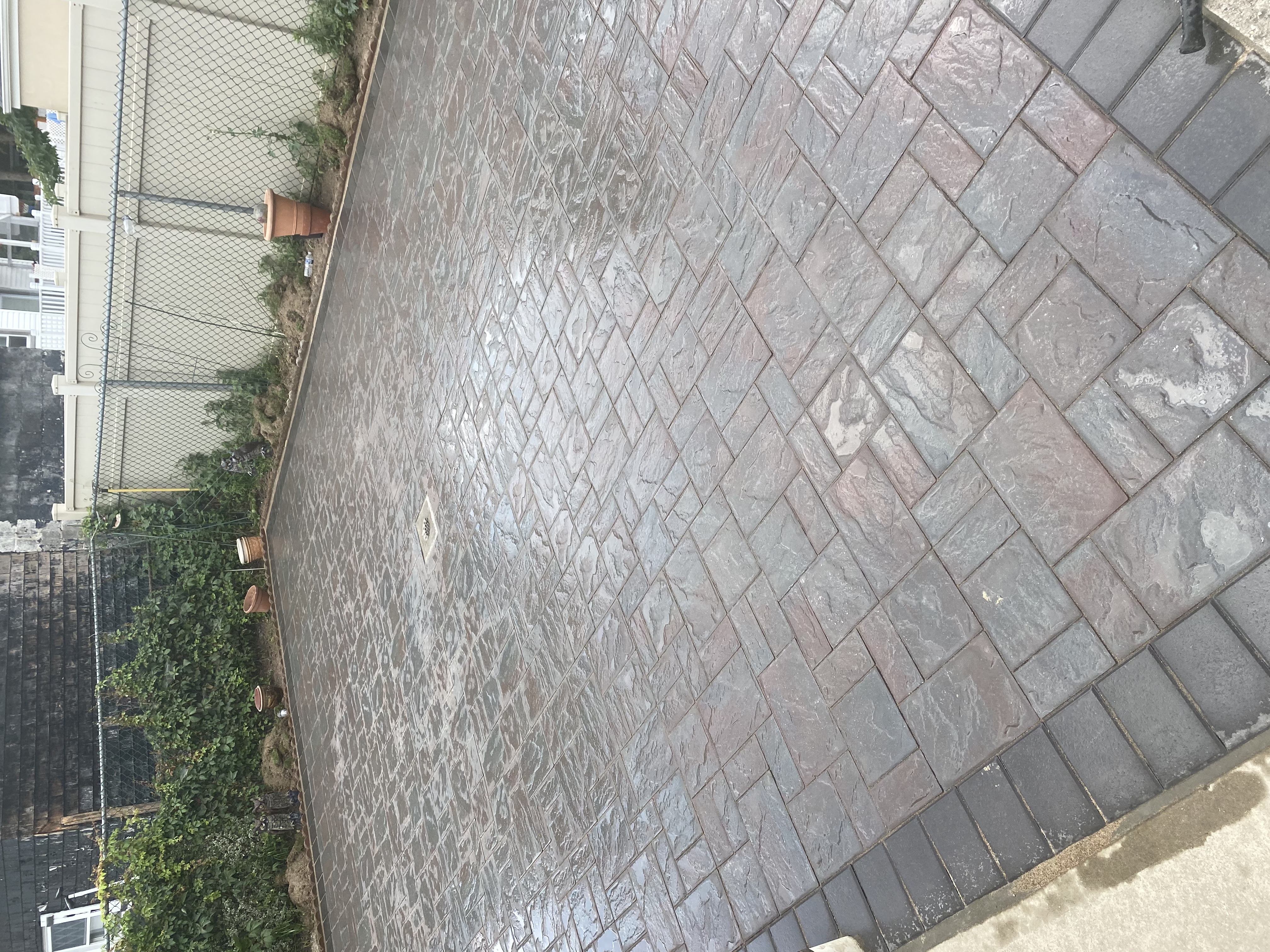 Herringbone pattern brick paver driveway