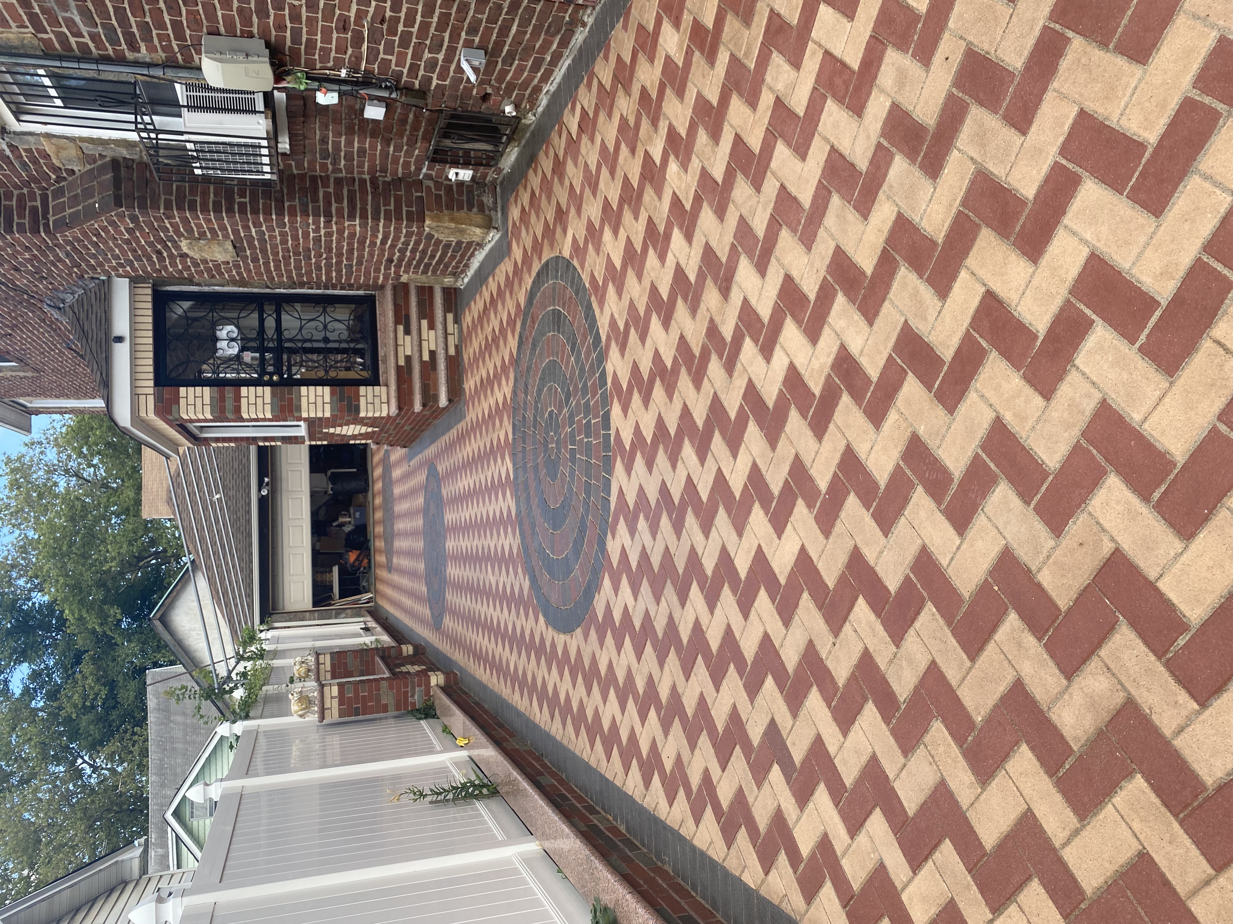 Decorative herringbone brick pavers with circular center design