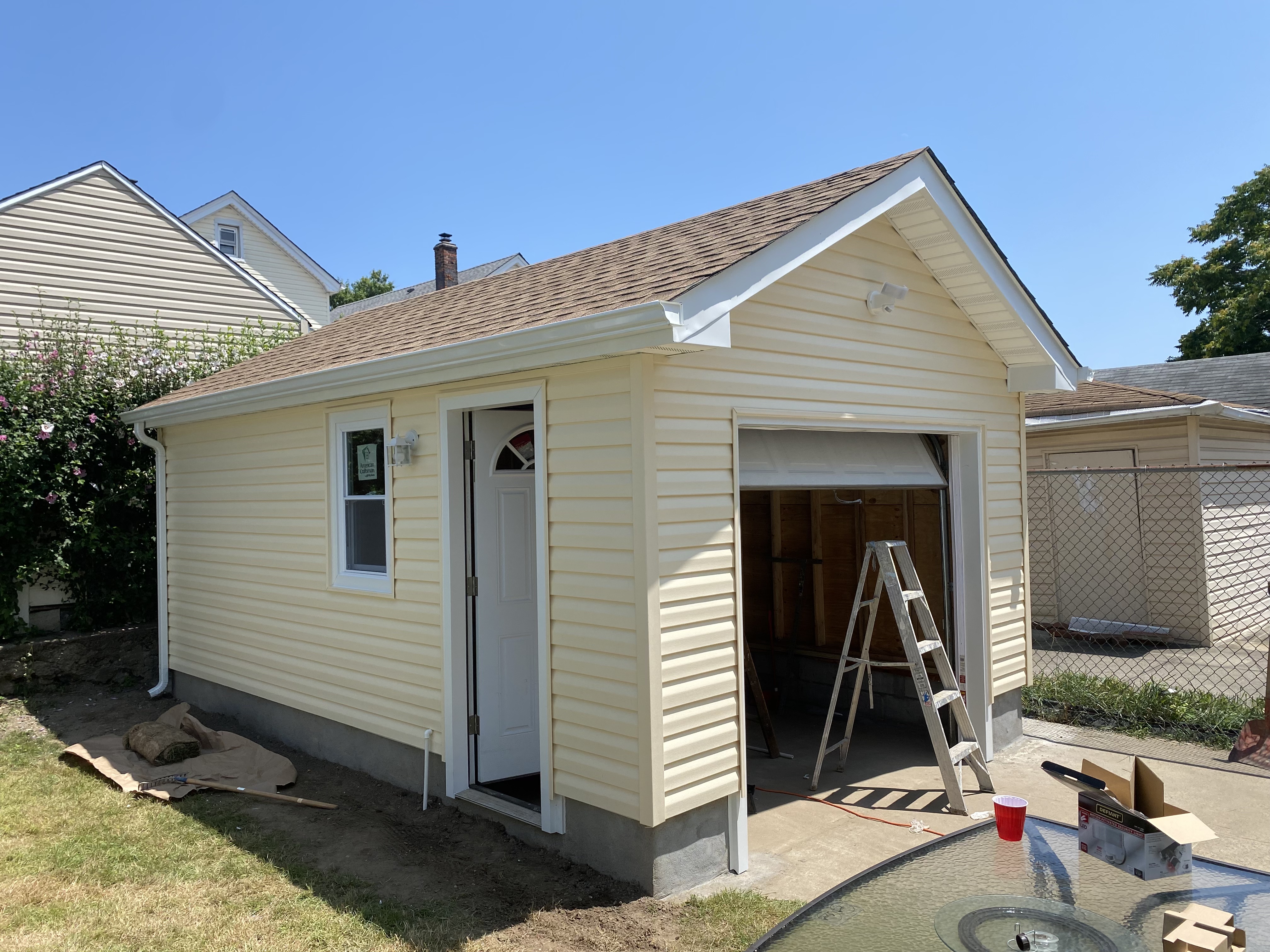 New siding installation on garage structure