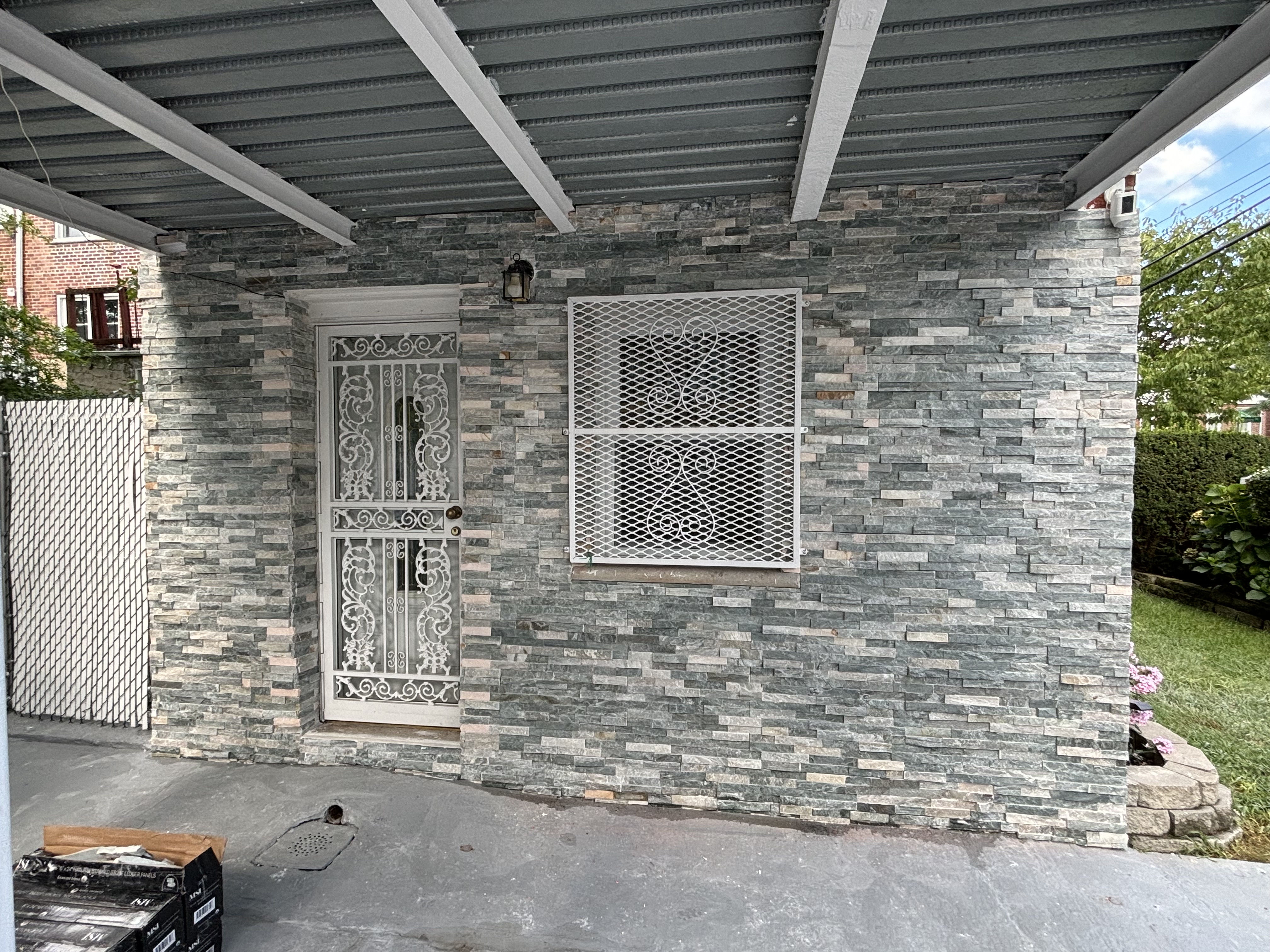 Gray stone veneer on exterior wall