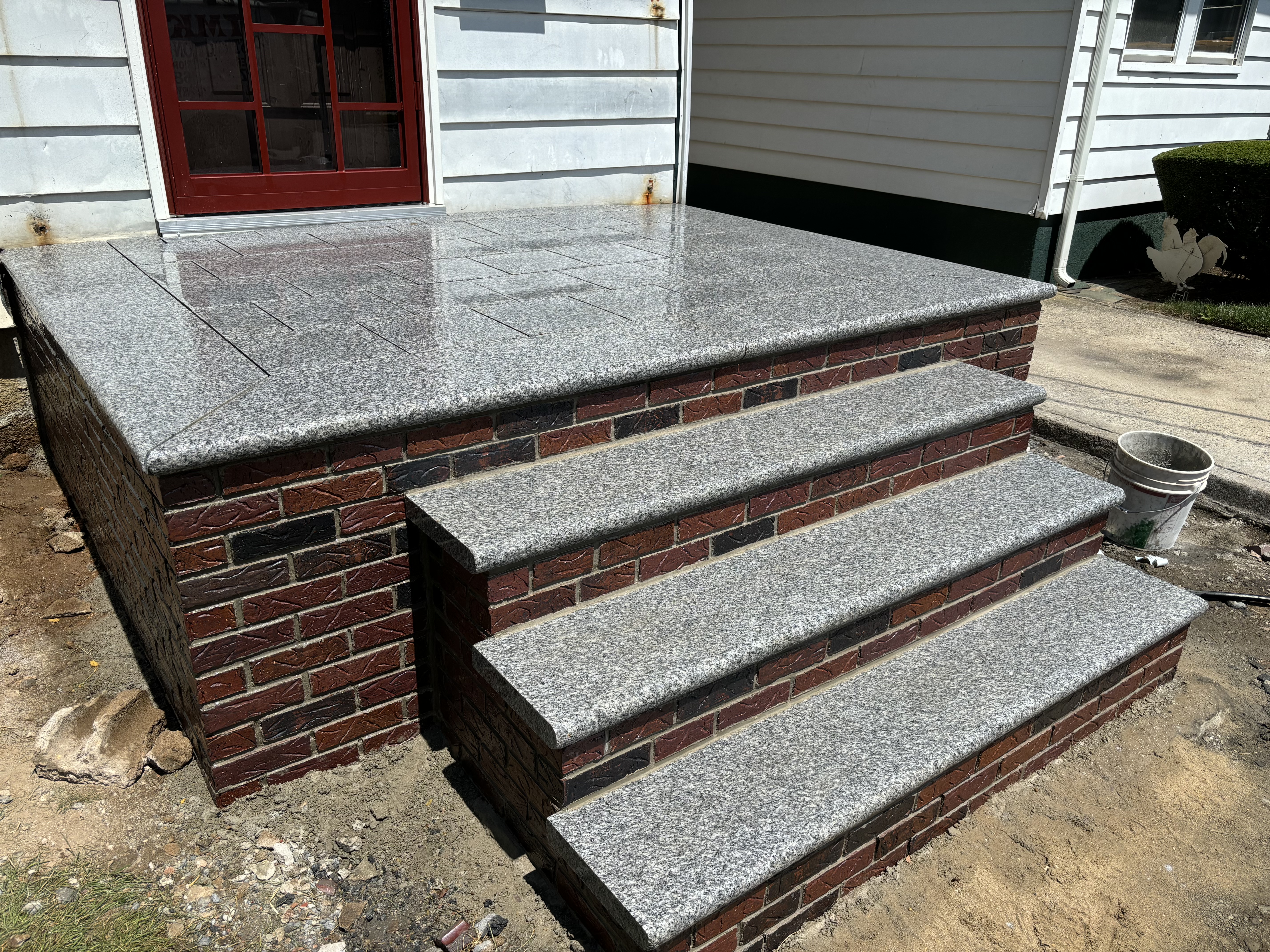 Custom granite steps with brick base